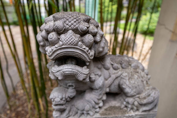 Japanese garden. Gate, statue, plants, Buddha, garden.