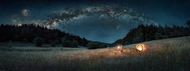 istock Man with lantern under the Milky Way 2231951320