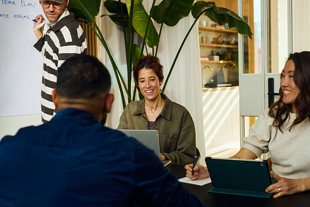 istock Creative businesspeople collaborating during meeting in modern office 2231951900