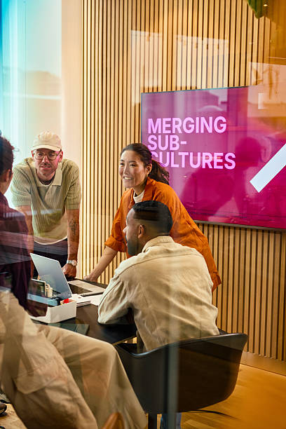 istock Business team discussing merging sub-cultures in modern office 2231951956