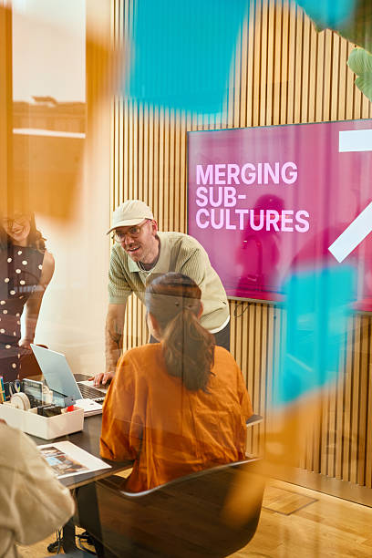 istock Business team discussing merging sub-cultures in modern office 2231951976