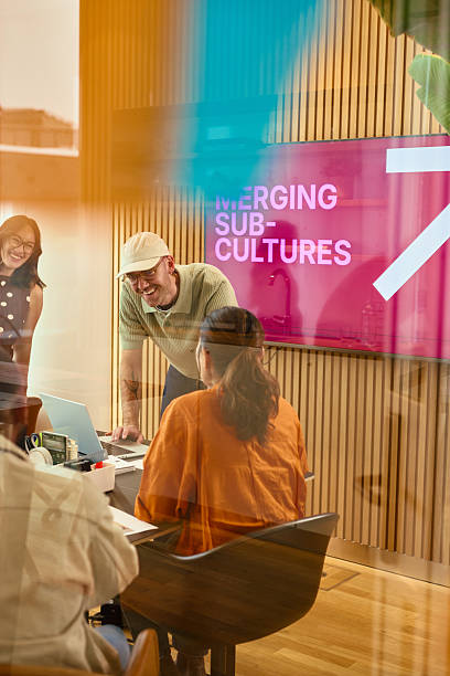 istock Business team discussing merging sub-cultures in modern office 2231952004