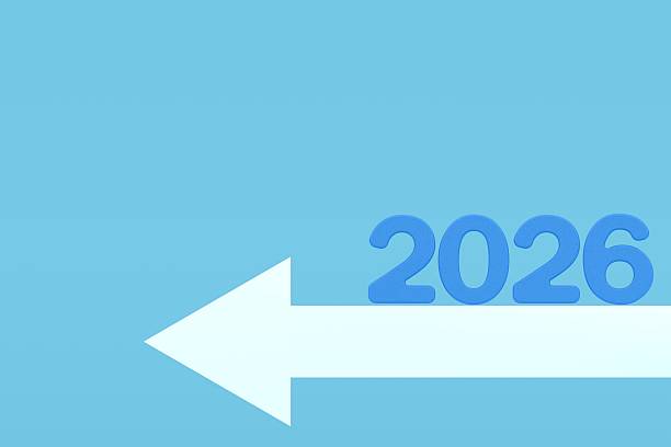 istock 3D number 2026 placed on a bold light blue arrow pointing forward, symbolizing growth, direction, and progress for the future on a clean blue background. 2231955493