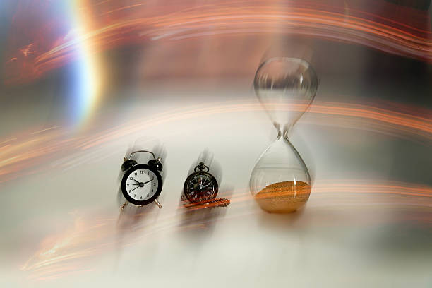 Different clocks and an hourglass represent the passage of time, with artistic light trails symbolizing its flow