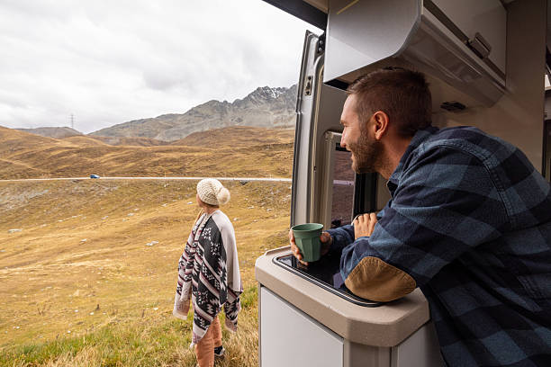 istock Couple Enjoying Coffee Outside Camper Van 2231960466