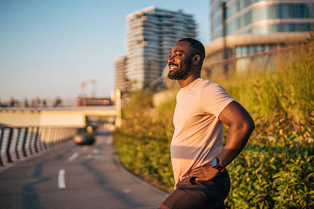 istock Smiling black man resting after exercising outdoors in the city 2231960496