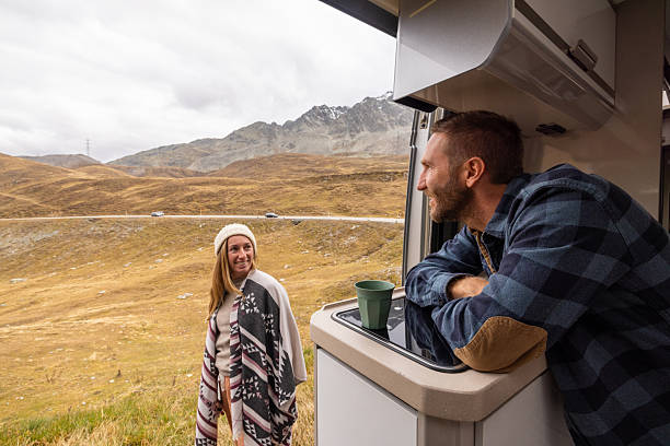 istock Couple Enjoying Mountain Camping Adventure Together 2231960516