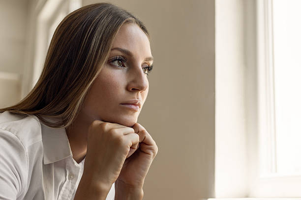 istock Dreamy woman looking away 2231960574