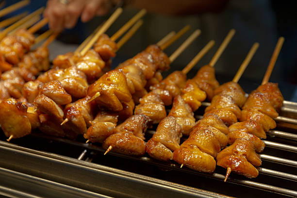 istock Grilled chicken tails skewered flame golden skin savory caramelization 2231960732