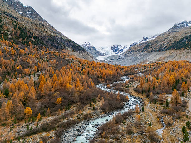 istock Autumn Valley with River and Snowy Mountains 2231964695