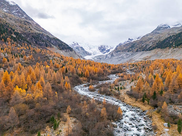 istock Autumn Valley with River and Snowy Mountains 2231965086