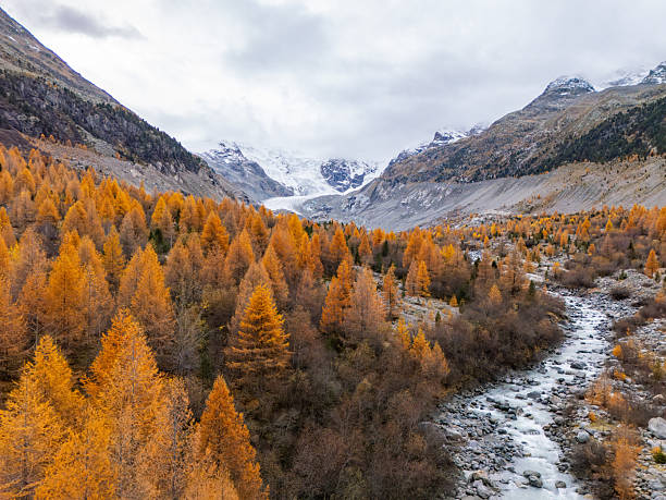 istock Autumn Valley with River and Snowy Mountains 2231968465