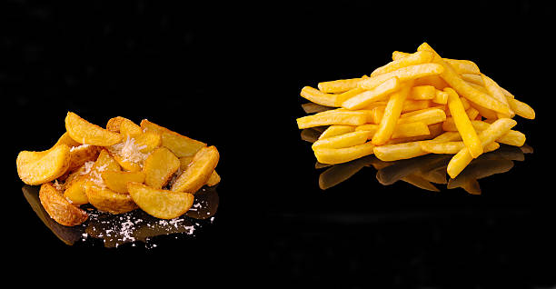 Crispy potato varieties served on reflective surface with seasoning