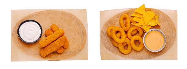 istock Variety of crispy snacks served with dips on a wooden platter 2231968619