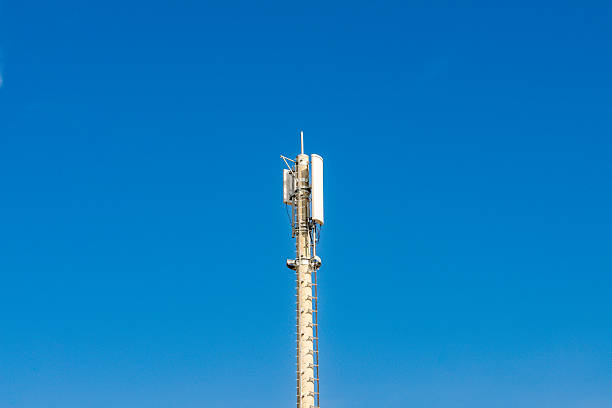 istock Telecommunications tower top section against blue sky 2231974458