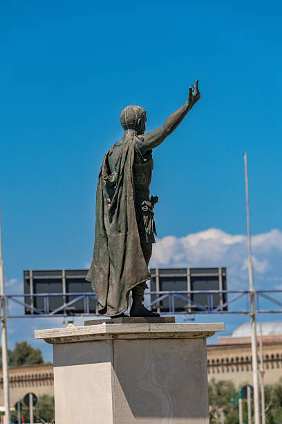 istock Back view of bronze statue with raised arm 2231974605