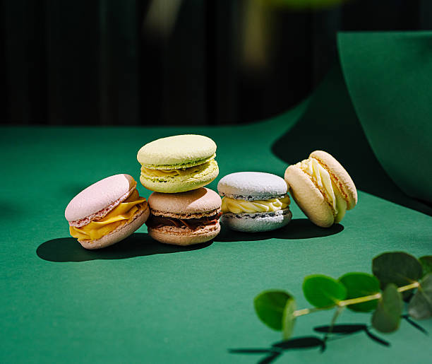 istock Delicious macarons displayed elegantly on a vibrant green table 2231975438