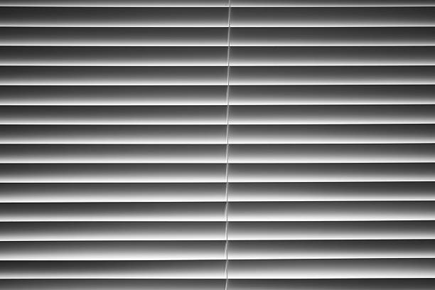 Bedroom Window with Partially Closed Blinds in Daylight