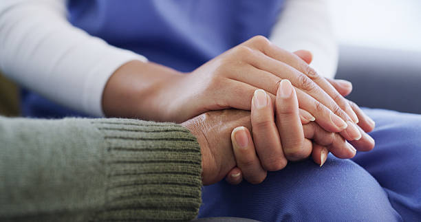 istock Holding hands, nurse and support for patient in nursing home, together or compassion for healthcare. Caregiver, medical help and care for elderly person with illness, assisted living and empathy 2231978340