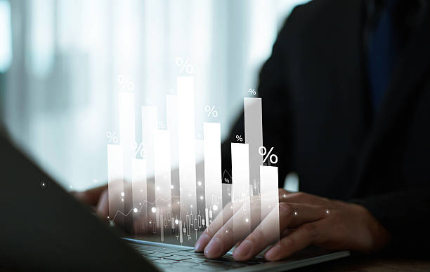 istock Businessman analyzing digital bar chart with percentage growth on laptop, representing financial data, investment strategy, business analytics, and stock market performance. 2231980940