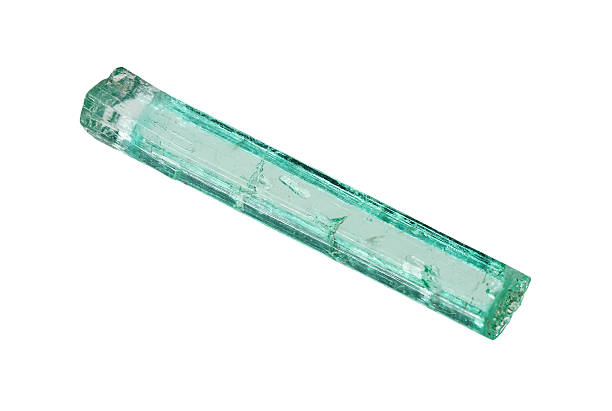 rough natural emerald crystal cutout on white background closeup