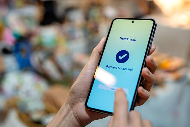 istock Mobile payment successful confirmation on smartphone at a store 2231983183