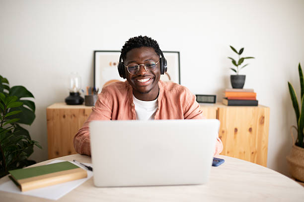 istock Young man working from home having a video call on his laptop 2231983294