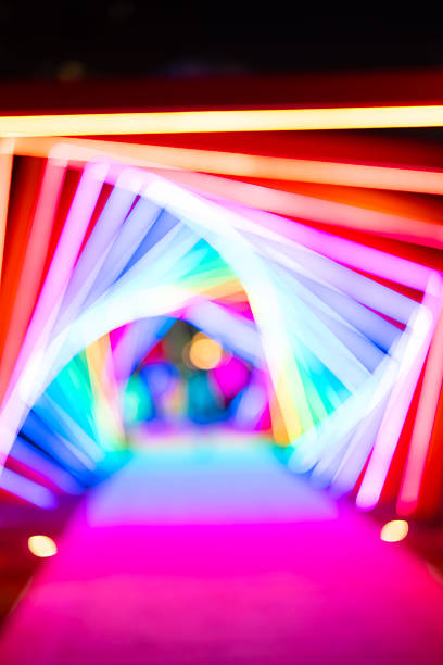 out-of-focus colorful light trails at vertical composition as background