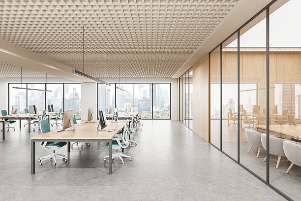 istock Modern open space office interior with workstations, glass meeting room and city view through large windows in bright daylight. 3D Rendering 2231983398