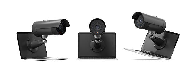 istock Surveillance camera emerging from laptop screen showing digital privacy breach concept on white background. 3D Rendering. 3D Rendering 2231983575