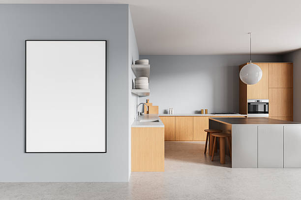 istock Modern kitchen interior with wooden cabinets and a large empty poster mockup on a gray wall as minimalist wall art template for design presentation. 3D Rendering 2231983765