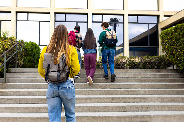 istock Students walking up stairs at school or university 2231984662