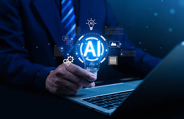 istock Businessman holding a light bulb with glowing AI icon, which symbolizes artificial intelligence, big data, innovation and this image is suitable for use in business, technology, AI and innovation. 2231986191