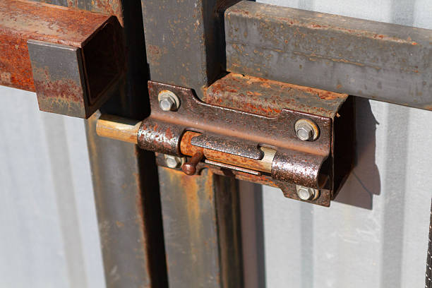 istock an iron rusty bolt on a metal door 2231987507