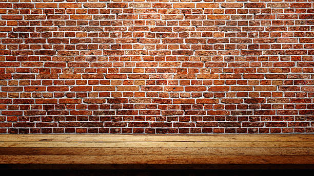 istock Rustic wooden table or shelf for product display with brick wall background. Product presentation, mockup, copy space, and template 2231990812