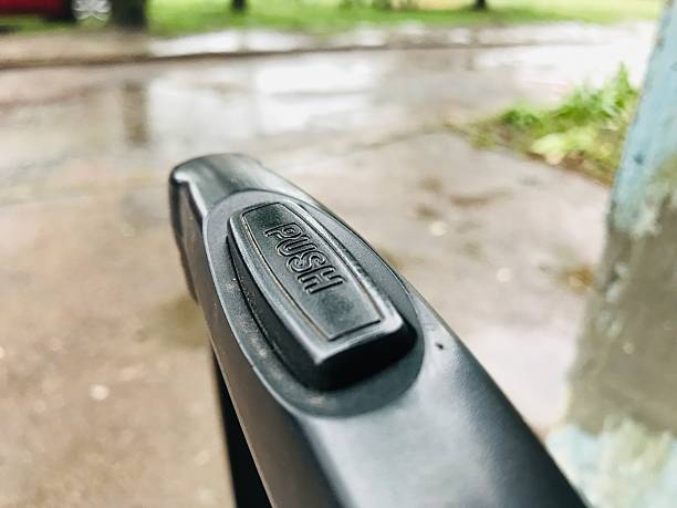 istock Travel suitcase handle showing push button mechanism 2231992969