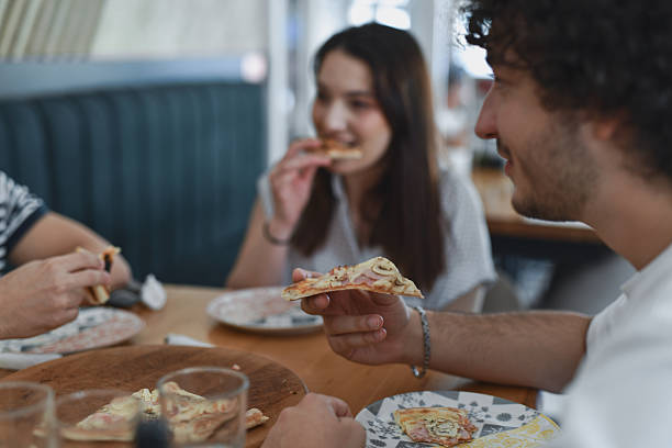 istock Male Looking Excited To Bite Into Pizza Slice 2231993044
