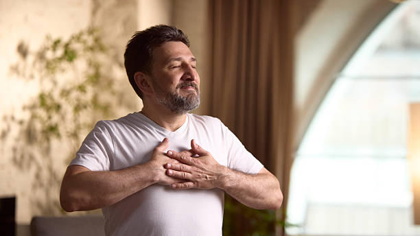istock Lifestyle and wellness. Middle aged man practicing mindfulness exercises, relaxed environment 2231994222