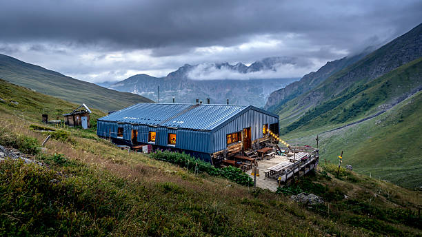 Valloire, Savoie, France - august 22, 2025 : The Aiguilles d'Arves refuge at sunset in the French Alps