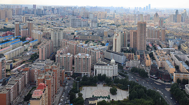 Harbin city, Northeast China. The image reflects rapid urban development, architectural expansion, and the growing skyline of this dynamic Chinese city. Suitable for illustrating themes of real estate, construction, tourism, and modern urban lifestyle in Northeast China.