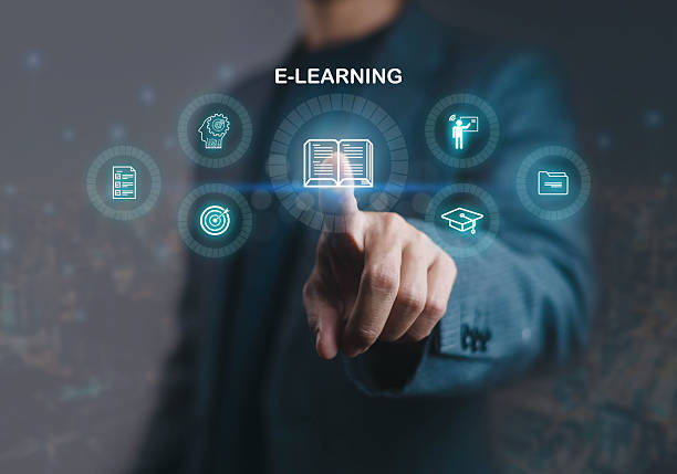 istock Digital e-learning interface with businessman pointing at online education icons, representing virtual training, knowledge sharing, academic innovation, and modern remote learning technology. 2231995869
