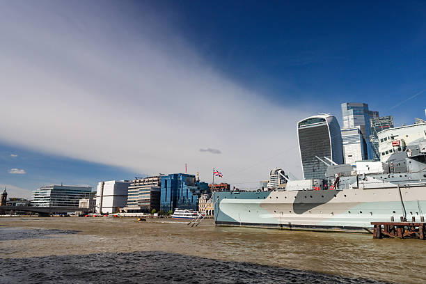 HMS Belfast, a Royal Navy Town-class light cruiser launched in 1938, is permanently moored on the River Thames in London between Tower Bridge and London Bridge. She served in World War II, taking part in the Arctic convoys, the Battle of North Cape (1943) where the German battleship Scharnhorst was sunk, and supported the D-Day landings in June 1944. After service in the Korean War (1950–52), she was retired in 1963. Saved from scrapping, HMS Belfast opened to the public as a museum ship under the Imperial War Museum in 1971 and remains one of only three surviving bombardment vessels from D-Day.