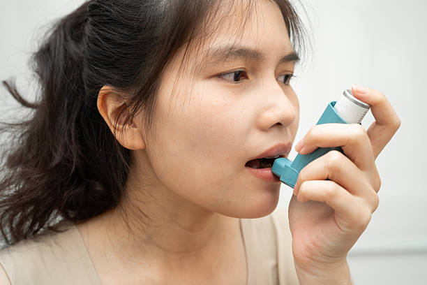 istock Asthma and chronic obstructive pulmonary disease COPD, Asian woman using metered dose inhaler MDI. 2232002454