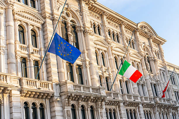 EU and Italian flag on a old government building in Triest, Italy