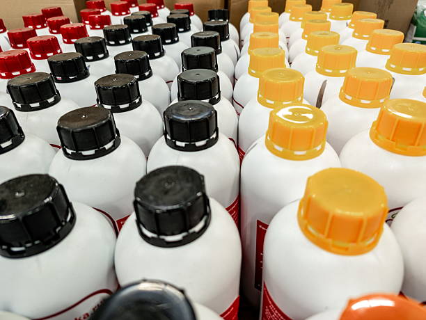 istock Containers of cleaning supplies arranged systematically in a warehouse highlighting various lid colors and organized storage practices 2232004676