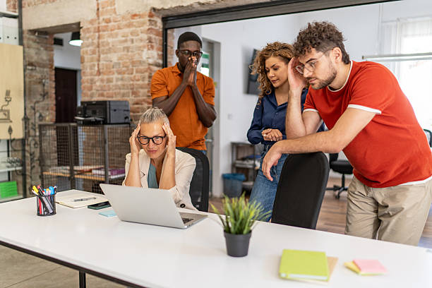 istock Stressed business team facing a problem on a laptop in the office 2232014061