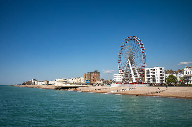 A large ferris wheel on the beach close to Worthing Pier, Worthing, West Sussex, UK