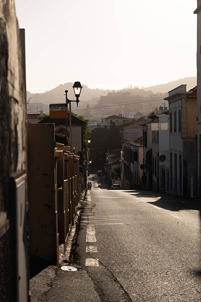 istock Narrow street in golden light, 2232020533