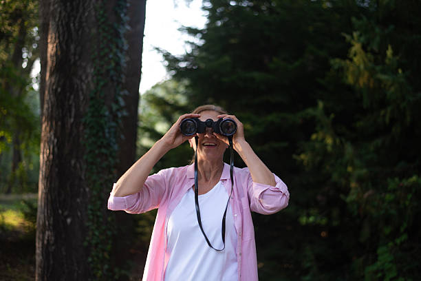 istock Woman Enjoying Birdwatching in the Forest 2232020729