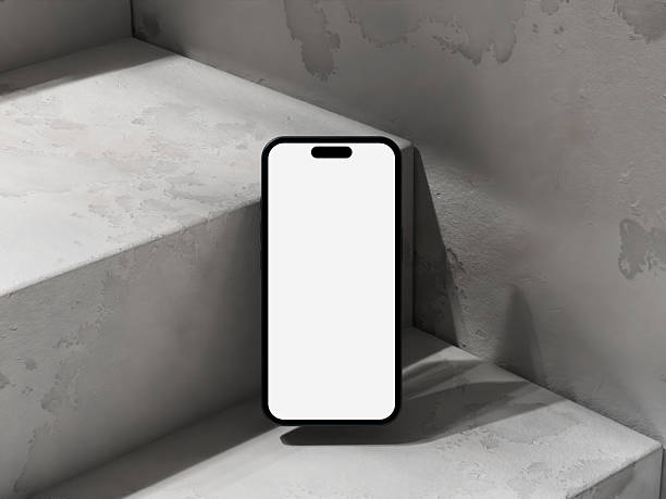 istock Minimalist phone mockup placed on cement stairs, casting soft lighting and shadow. 2232022615